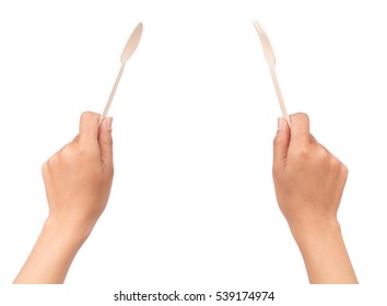 Hand Holding Wood Fork And Spoon  Isolated On White Background