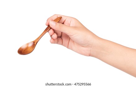 Hand Holding Wood Spoon Isolated On White Background.