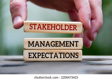 Hand Holding Wooden Block With Text - Stakeholder Management And Expectations. Business Relationship Concept.