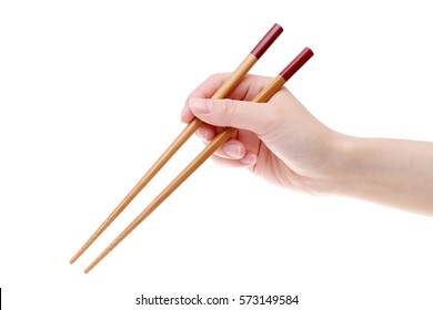Hand holding wooden chopsticks isolated on white background