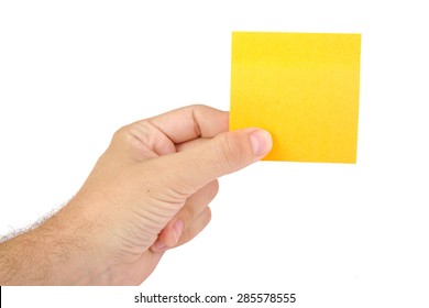 Hand holding a yellow notepaper or postit isolated on white  background