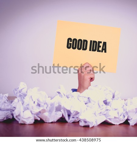 HAND HOLDING YELLOW PAPER WITH GOOD IDEACONCEPT