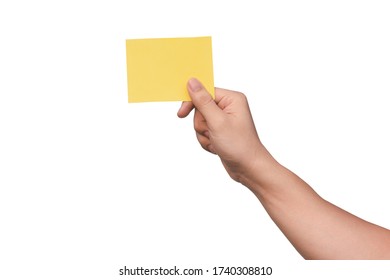 Hand holding yellow paper isolated on white with clipping path