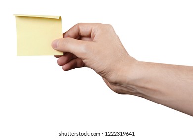 Hand holding a yellow sticker, isolated on white background