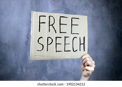 Hand Holds A Banner With The Inscription Free Speech, Censorship Concept