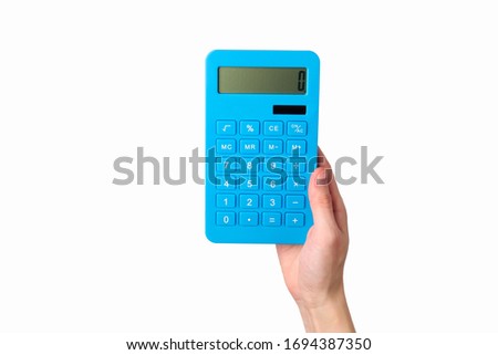 Hand holds blue calculator Isolated on a white background.