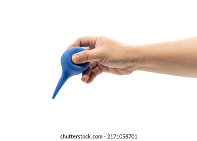 A Hand Holds A Blue Rubber Blowing Dust Ball Isolated On A White Background