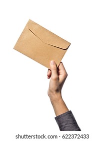 Hand Holds An Envelope, On A White Isolated Background.