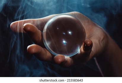 The Hand Holds A Glass Sphere