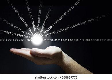 Hand holds a glowing ball emitting datastreams