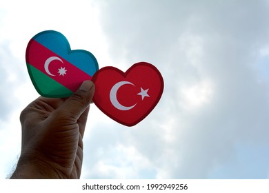 Hand Holds A Heart Shape Azerbaijan And Turkey Flag, Love Between Two Countries