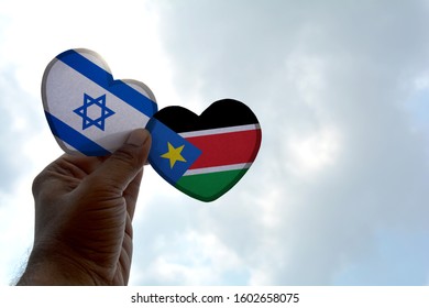 Hand Holds A Heart Shape Israel And South Sudan Flag, Love Between Two Countries