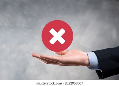 Hand holds icon,cancellation symbol,cancel icon.Cross mark flat red icon.round X mark.cancel button.Wrong.cross mark rejection.Declined.On dark background.Banner.Copy space.Place for text - Shutterstock ID 2022958307