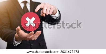 Hand holds icon,cancellation symbol,cancel icon.Cross mark flat red icon.round X mark.cancel button.Wrong.cross mark rejection.Declined.On grey background.Banner.Copy space.Place for text