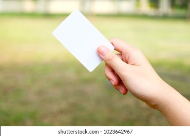 Hand Holds Keycard Of Door Access