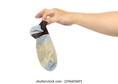 A Hand Holds An Old Smelly Sock