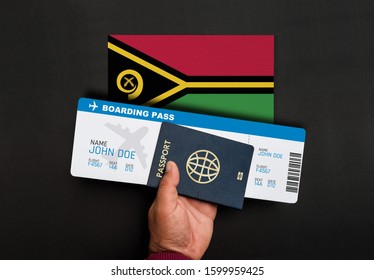 Hand Holds Passport And Boarding Pass With Flag Of Vanuatu