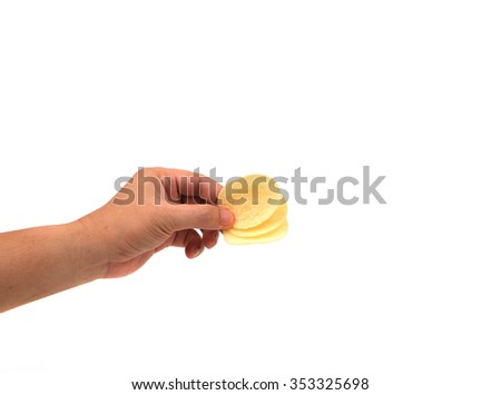 hand holds potato chips. Isolated on a white background.