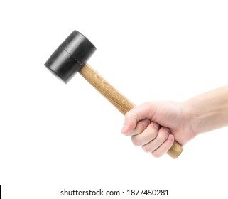 The hand holds a rubber mallet with a wooden handle. Сlose up. Isolated on a white background.
