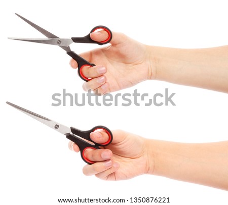 Hand holds scissors isolated on white background. Scissors in hand