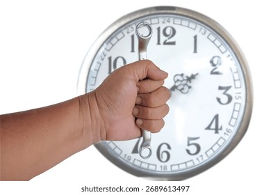 Hand holds a spanners with blur white clock.
quality concept.