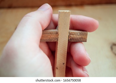 Hand holds wooden cross, easter day, world prayer day, international prayer day - Powered by Shutterstock