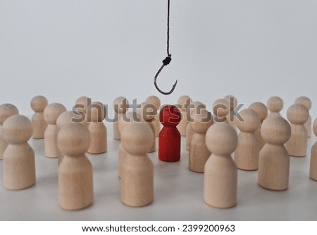 Hand with hook pulls red human figure out of crowd. Reveal disloyalty, repression and dissent