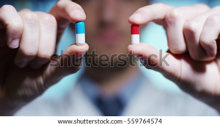 hand of a hospital medical expert shows the pill to be taken to his patient. concept of generical pills