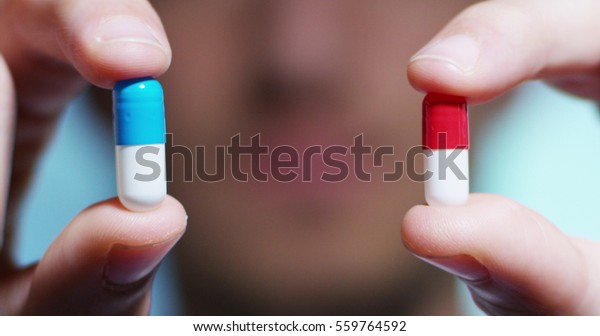 hand of a hospital\
medical expert shows the pill to be taken to his patient. concept\
of generical pills