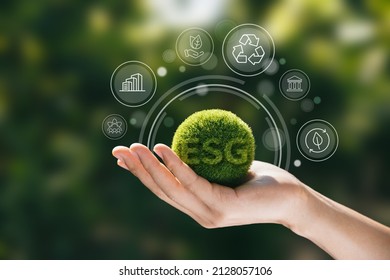 Hand of human holding green earth ESG icon for Environment Social and Governance, World sustainable environment concept. - Shutterstock ID 2128057106
