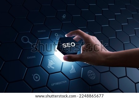 Hand of human putting hexagon piece to full fill the part of SEO Search Engine Optimization. Digital marketing process, Strategy, Business Technology concept.