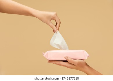Hand Hygiene. Female Picked Wet Wipes From Pink Pack To Stop Coronavirus. Home And Travel Hygiene For Virus And Bacterial Infection Prevention.  - Shutterstock ID 1745177810