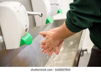 Hand Hygiene And Food Safety. Factory Worker Washing Hands. Coronavirus Protection