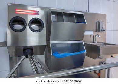 Hand Hygiene Station With Turnstile Gate And Sanitizer Before Entering Production Area. Infection Prevention, Disinfection, Industrial, Covid 19, Coronavirus Concept