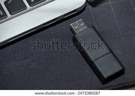 Hand inserting USB flash memory drive plugged into a computer laptop port.

Hand inserting Hardware Wallet plugged into a computer laptop.