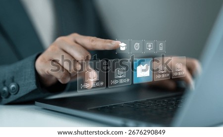 Hand interacting with digital education interface on laptop, e-learning platform, online courses, virtual library, academic resources, modern education technology and digital study systems.