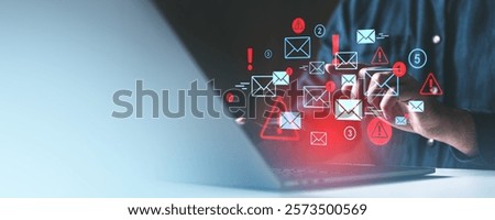 Hand interacting with digital email and alert icons, glowing symbols over a dark backdrop, concept of communication and spam alerts