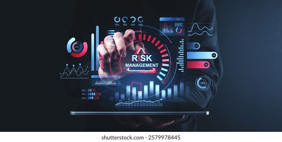 Hand interacting with a digital interface illustrating risk management with vibrant charts, graphs, and analytics on a dark background. Innovation concept