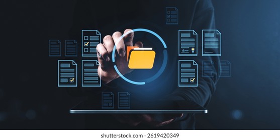 Hand interacting with floating digital folder icon and document files, modern style on dark background, concept of data organization and storage