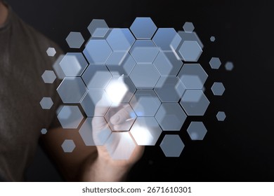 Hand Interacting with Hexagon Technology Interface