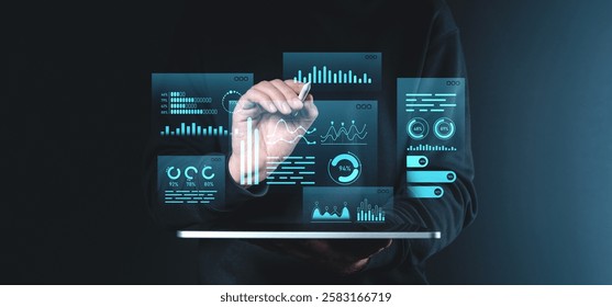 A hand interacts with glowing holographic data graphs and charts, showcasing futuristic digital visualization on a dark background. Concept of innovation