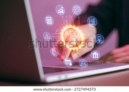 A hand interacts with a laptop while various icons representing answers engine optimization concepts appear above the screen. This occurs in a modern workspace environment.