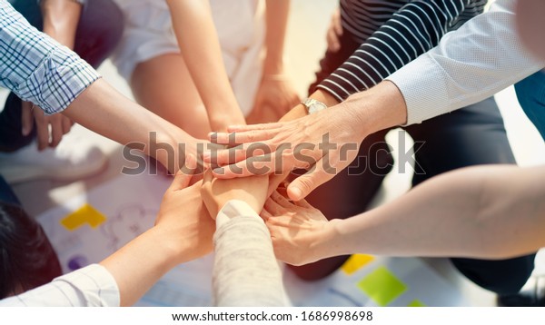 Hand join together for work togetherness,\
Hand stack for business and service, Team volunteering or teamwork.\
Concept connection of community and charity. Group of business\
workforce participation.