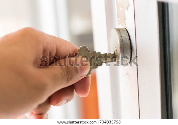 Hand Key Unlock Door Stock Photo Edit Now 704033758