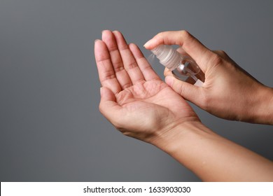 Hand of lady that applying alcohol spray or anti-bacteria spray to prevent the spread of germs, bacteria and virus. Personal hygiene concept.  - Shutterstock ID 1633903030