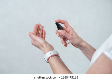 Hand of lady with watch that applying alcohol spray or anti bacteria spray to prevent spread of germs, bacteria and virus. Personal hygiene concept. Sanitizer - Shutterstock ID 1680475165
