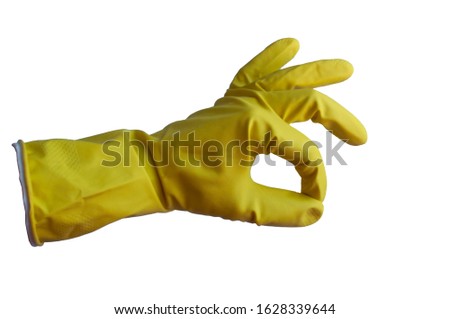  Hand in a latex yellow glove isolated on white. Woman's hand gesture or sign isolated on white. shows the character like 