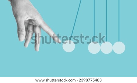 Hand launches pendulum balls. Start-up concept. Newton's cradle. Sphere hanging on threads. Launch Business Ideas Creativity Concept