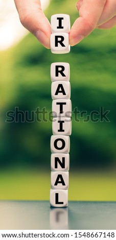 Hand lifts two dice and changes the word 