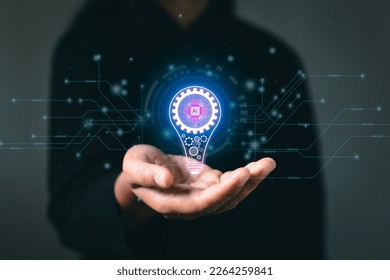 Hand with light bulb and coding AI futuristic future digital technology. Innovation, inspiration, creative solution idea for modern business intelligence technology concept.